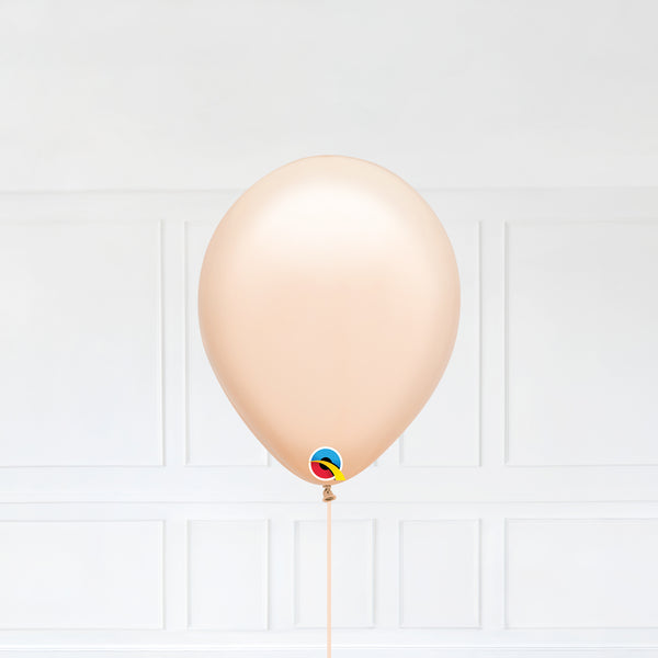 Blush color Latex balloon inflated with helium and a matching with 1.5 meter ribbon