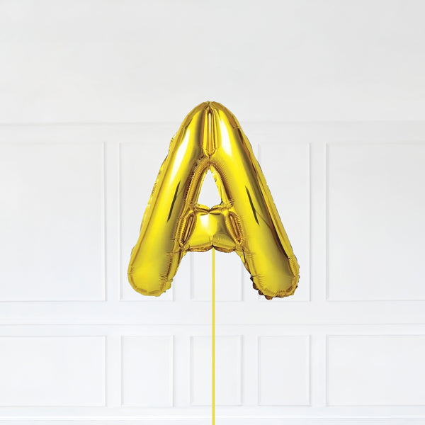 Letter A Foil Balloon Inflated With Helium, Gold Color Letter A with Balloon String and Balloon Weight.