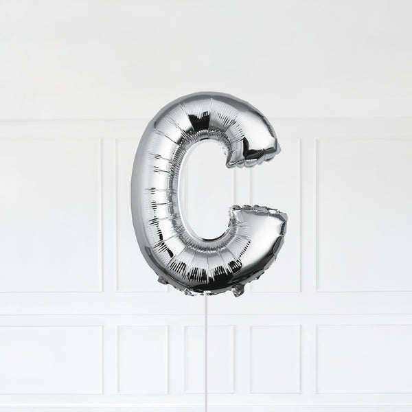 Letter C Foil Balloon Inflated With Helium, Silver Color Letter C with Balloon String and Balloon Weight.