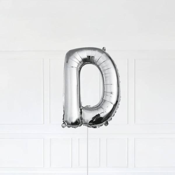 Letter D Foil Balloon Inflated With Helium, Silver Color Letter D with Balloon String and Balloon Weight.