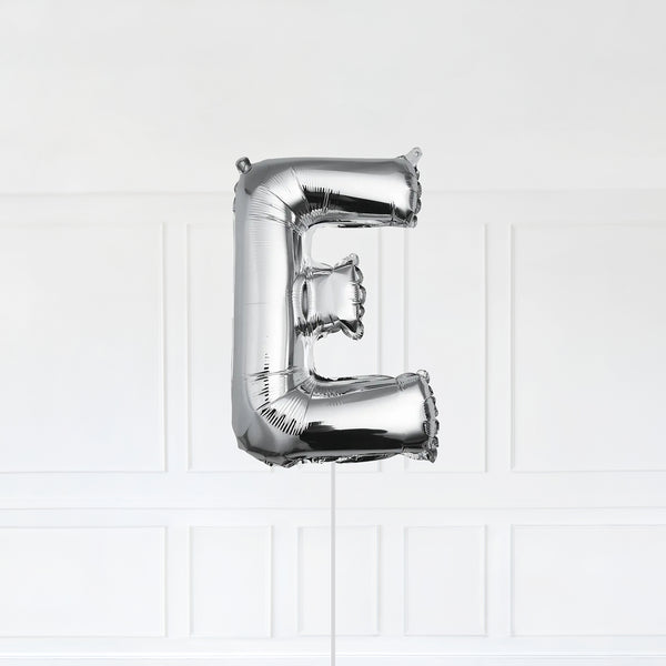 Letter E Foil Balloon Inflated With Helium, Silver Color Letter E with Balloon String and Balloon Weight.