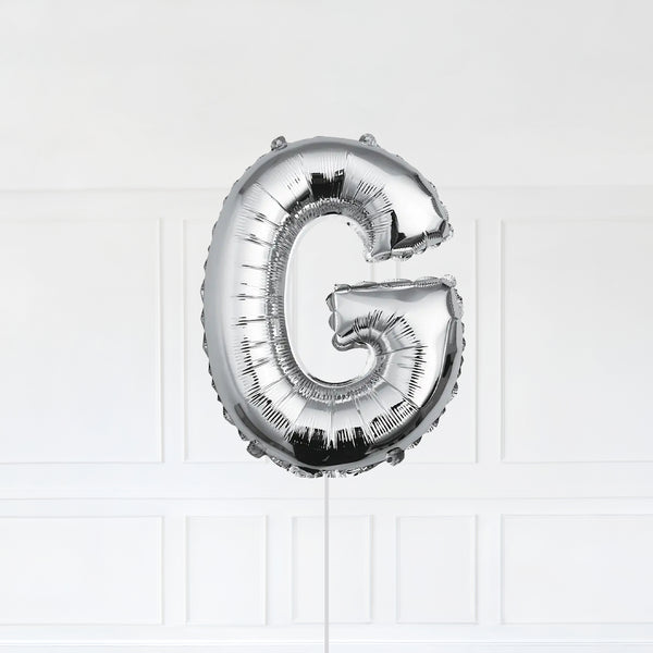 Letter G Foil Balloon Inflated With Helium, Silver Color Letter G with Balloon String and Balloon Weight.