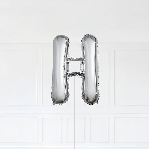 Letter H Foil Balloon Inflated With Helium, Silver Color Letter H with Balloon String and Balloon Weight.