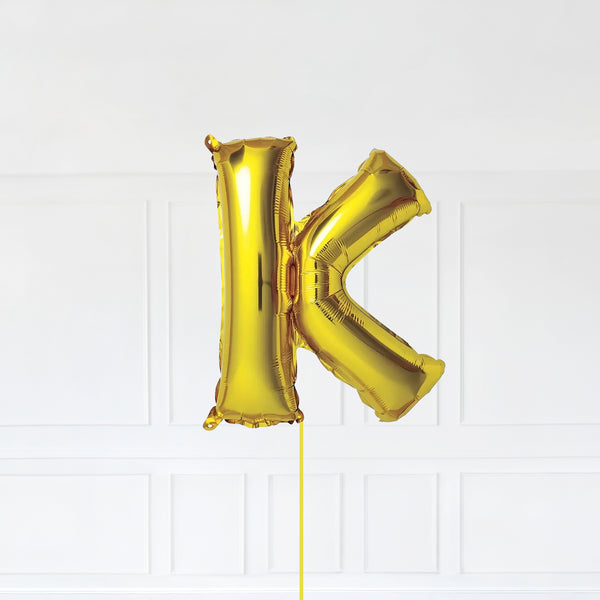 Letter K Foil Balloon Inflated With Helium, Gold Color Letter K with Balloon String and Balloon Weight.