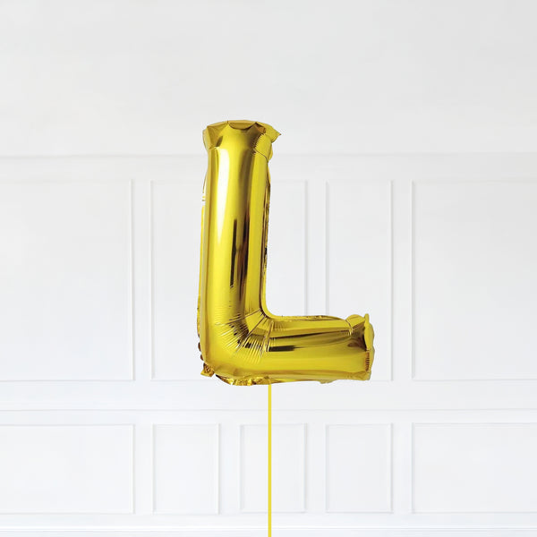 Letter L Foil Balloon Inflated With Helium, Gold Color Letter L with Balloon String and Balloon Weight.