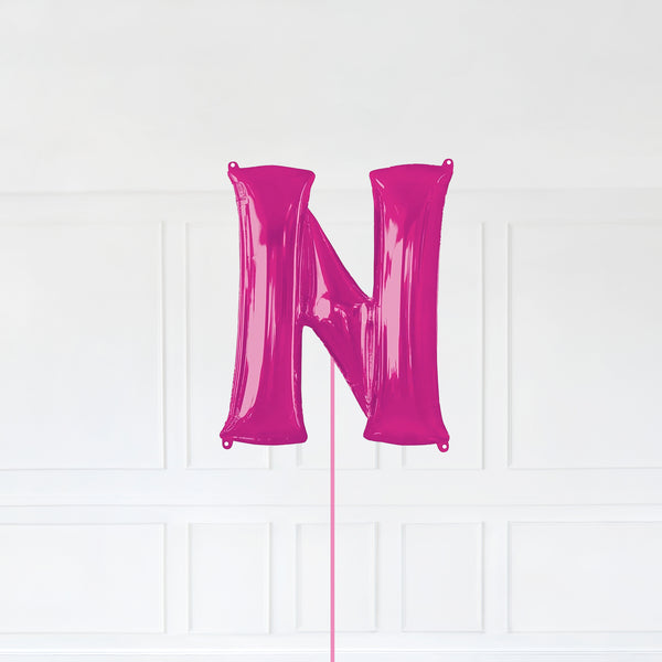 Letter N Foil Balloon Inflated With Helium, Pink Color Letter N with Balloon String and Balloon Weight.