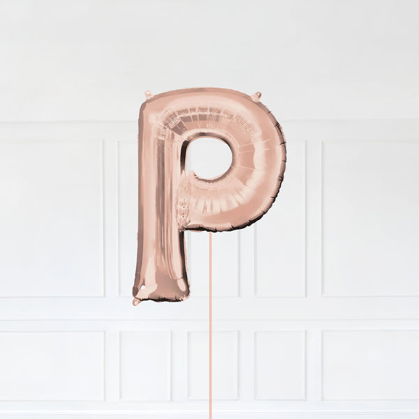 Letter P Foil Balloon Inflated With Helium, Rose Gold Color Letter P with Balloon String and Balloon Weight.