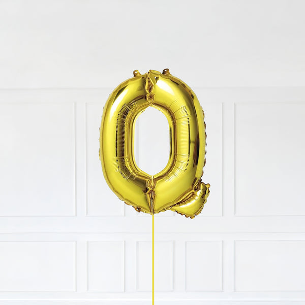 Letter Q Foil Balloon Inflated With Helium, Gold Color Letter Q with Balloon String and Balloon Weight.