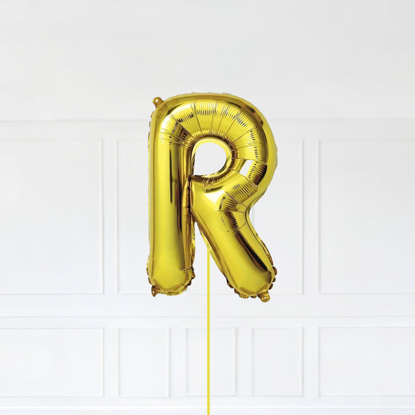 Letter R Foil Balloon Inflated With Helium, Gold Color Letter R with Balloon String and Balloon Weight.