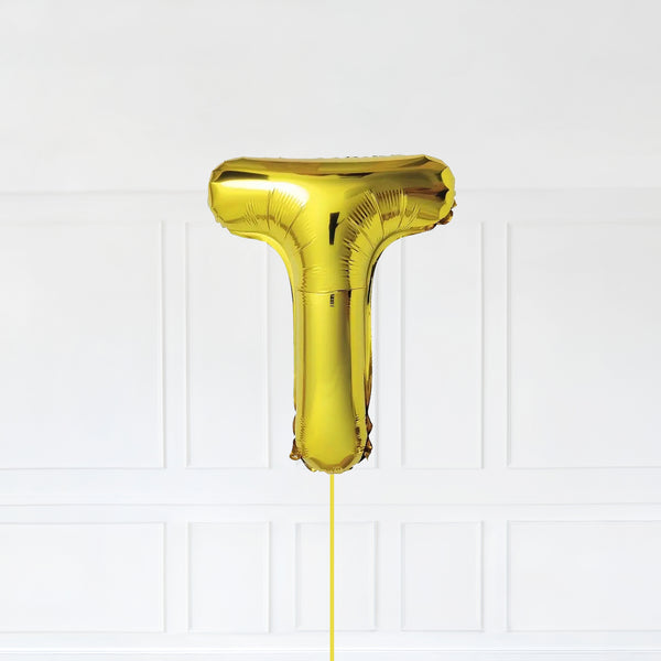 Letter T Foil Balloon Inflated With Helium, Gold Color Letter T with Balloon String and Balloon Weight.