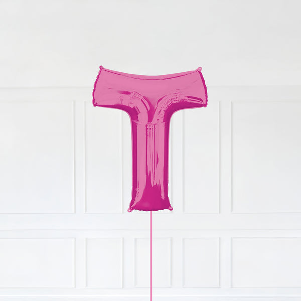 Letter T Foil Balloon Inflated With Helium, Pink Color Letter T with Balloon String and Balloon Weight.