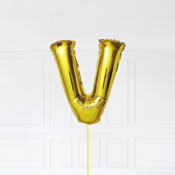 Letter V Foil Balloon Inflated With Helium, Gold Color Letter V with Balloon String and Balloon Weight.