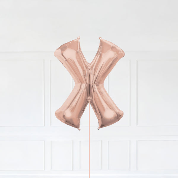 Letter X Foil Balloon Inflated With Helium, Rose Gold Color Letter X with Balloon String and Balloon Weight.