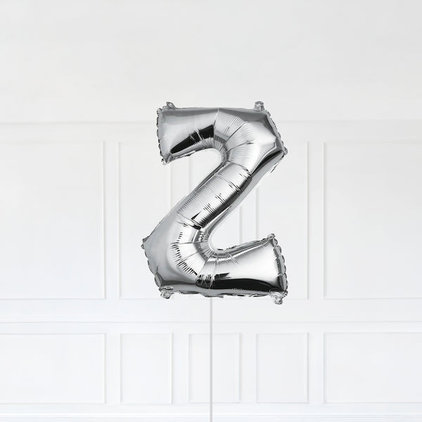 Letter Z Foil Balloon Inflated With Helium, Silver Color Letter Z with Balloon String and Balloon Weight.