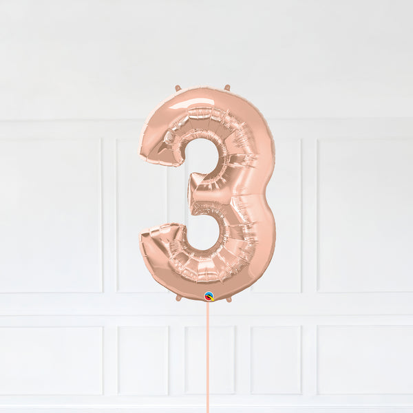 Number 3 Foil Balloon Inflated With Helium, Rose Gold Color Number Three with Balloon String and Balloon Weight.