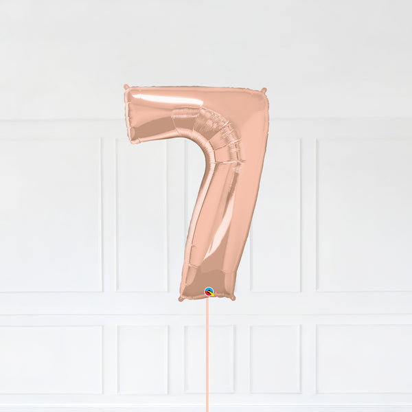 Number 7 Foil Balloon Inflated With Helium, Rose Gold Color Number Seven with Balloon String and Balloon Weight.