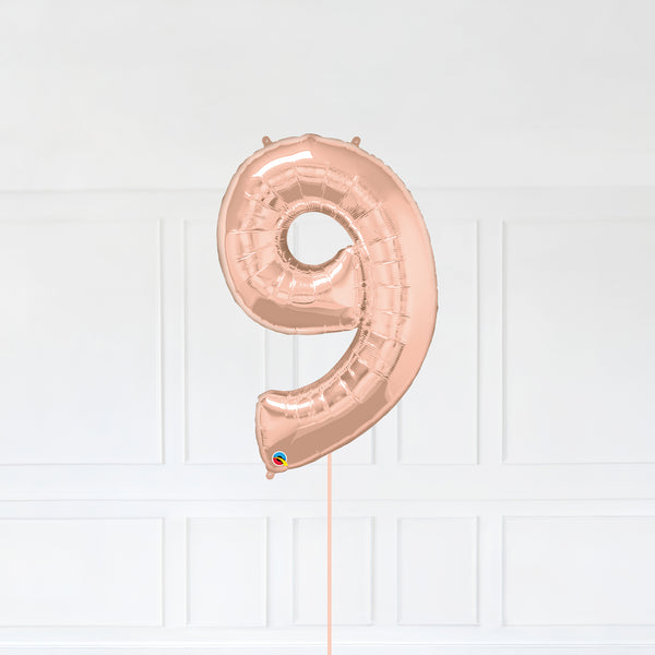 Number 9 Foil Balloon Inflated With Helium, Rose Gold Color Number Nine with Balloon String and Balloon Weight.