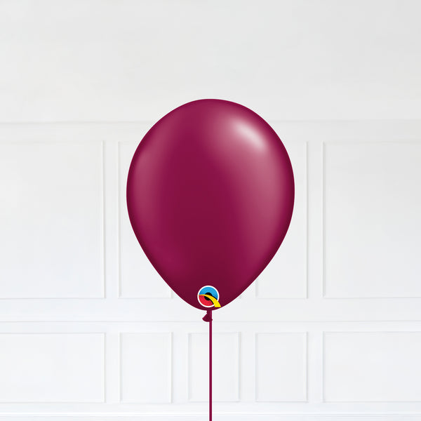 Radiant Pearl Burgundy color Latex balloon inflated with helium and a matching with 1.5 meter ribbon