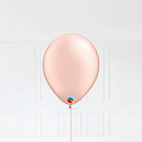 Pastel Pearl Peach color Latex balloon inflated with helium and a matching with 1.5 meter ribbon