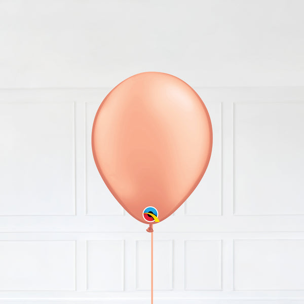 Rose Gold color Latex balloon inflated with helium and a matching with 1.5 meter ribbon